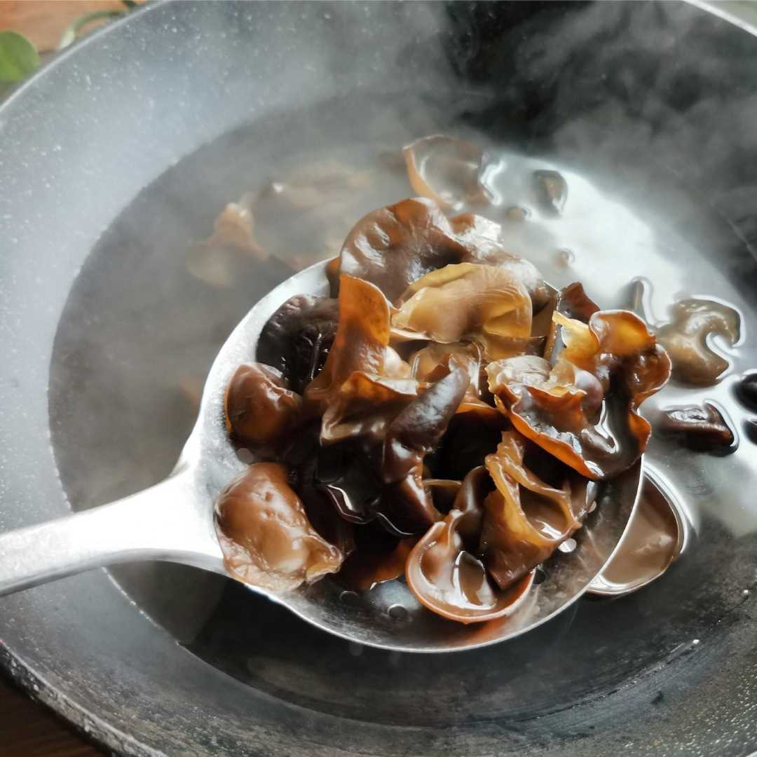 Once the water's boiling, we're gonna Pour in black fungus and cook for 2-3 minutes