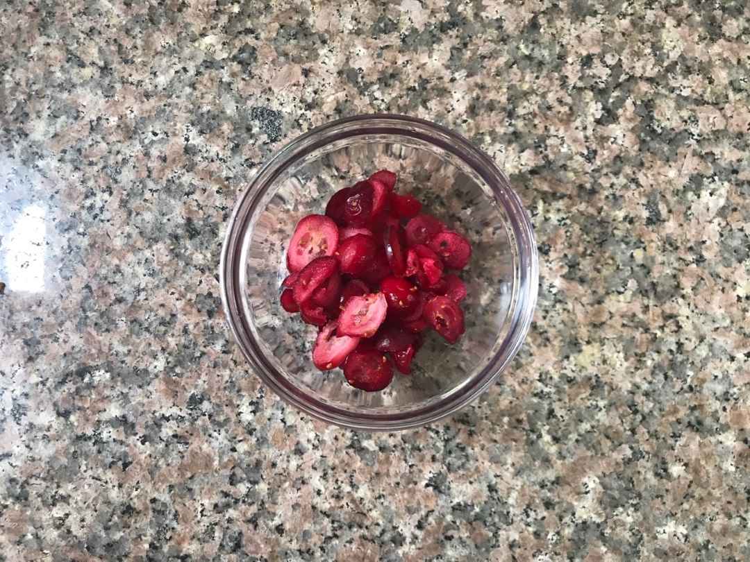 Cut frozen cranberries into small pieces