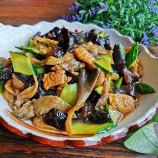 Mushrooms, black fungus and cucumber stir-fry with pork