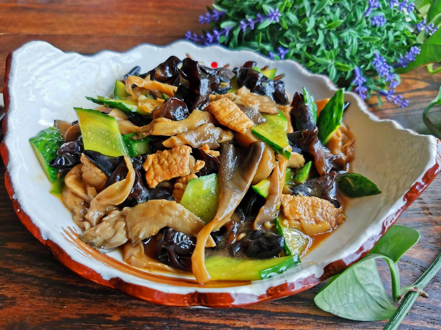 Mushrooms, black fungus and cucumber stir-fry with pork