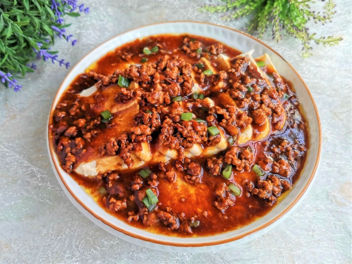 Steamed tofu and egg in minced meat sauce