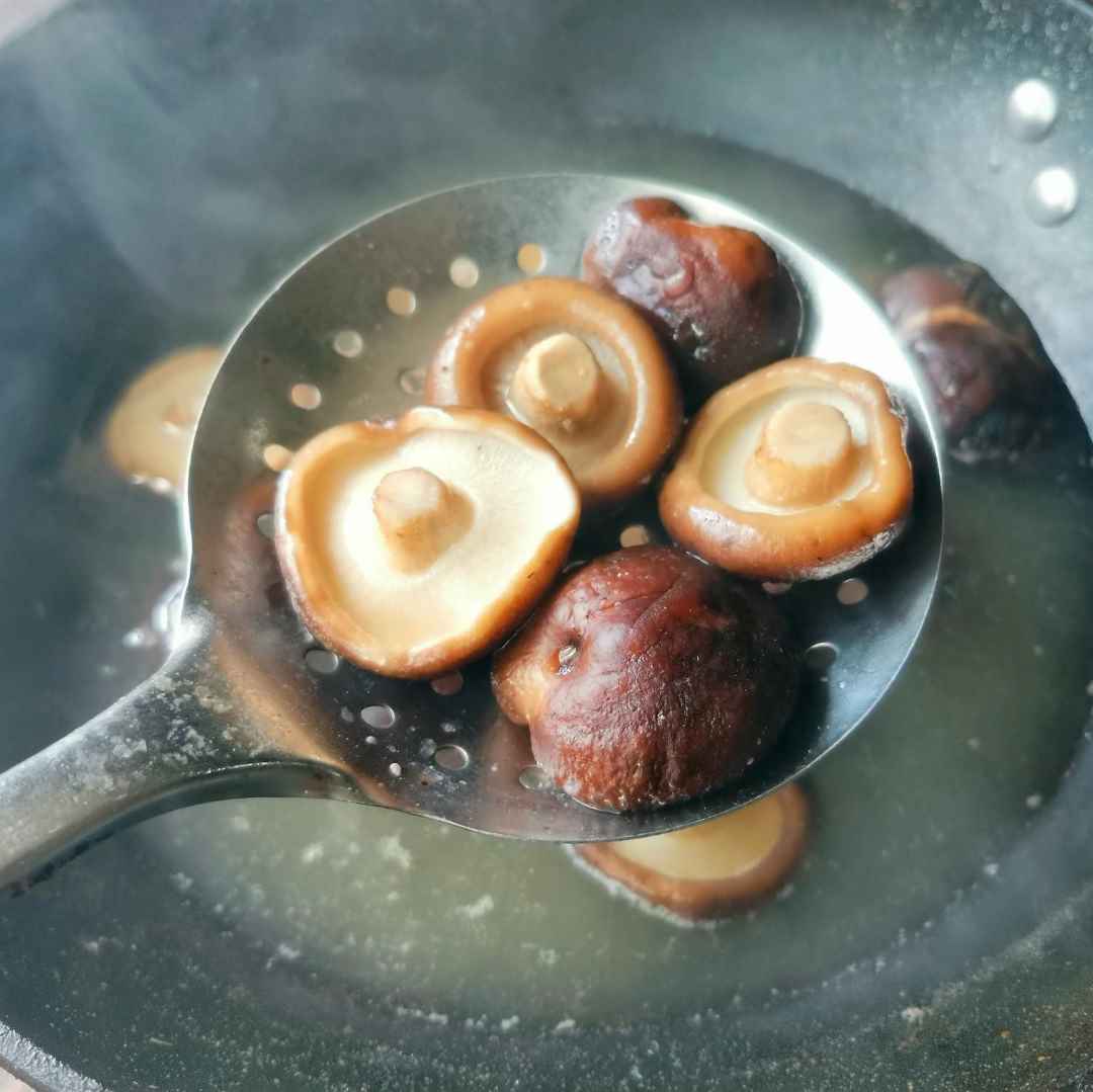 Blanch the shiitake mushrooms.