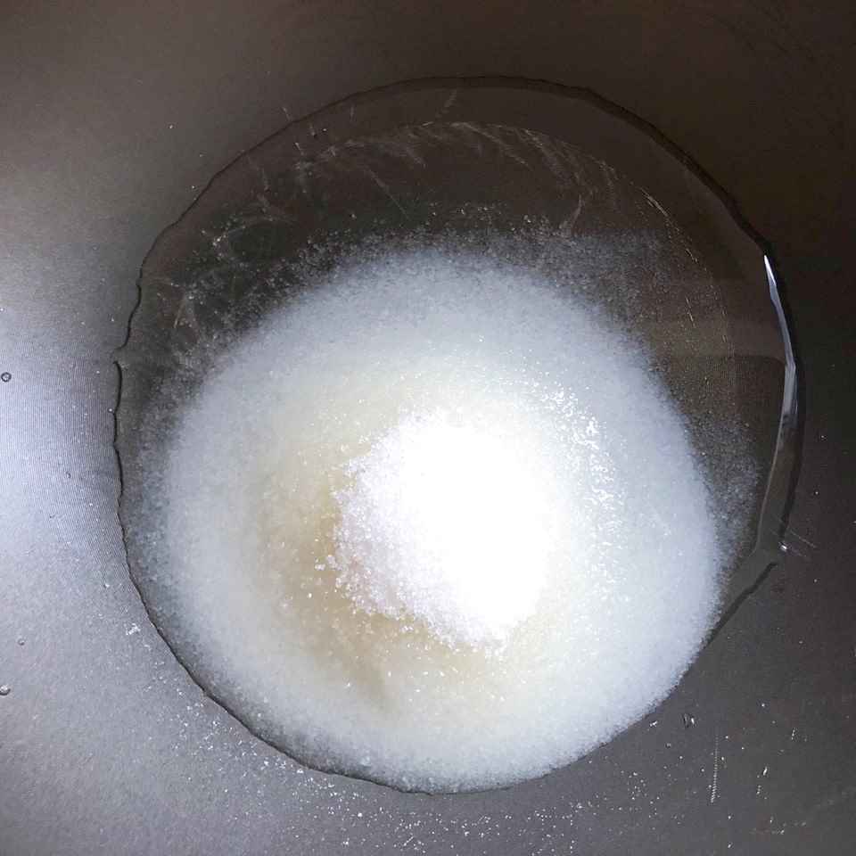 Pour water and sugar into the pot.