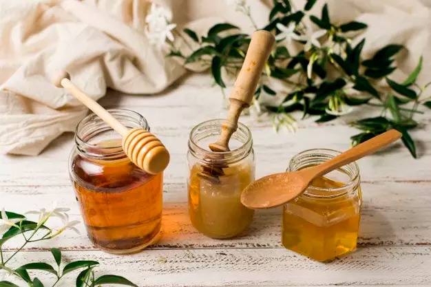 How do I replace sugar with honey when baking?